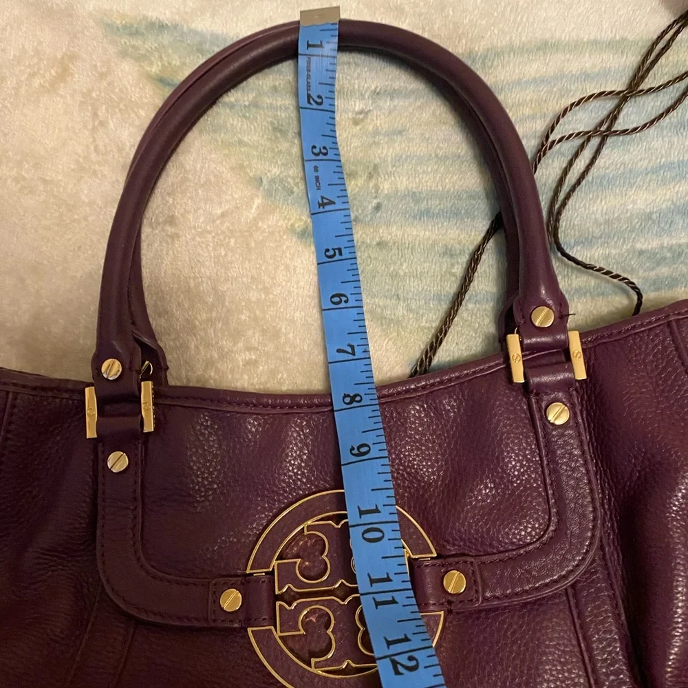 Tory Burch purple bag.